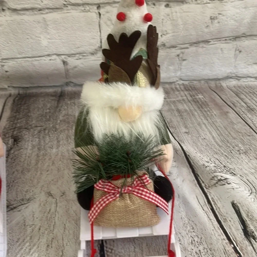 NIB! Two Christmas gnome figures on sleds